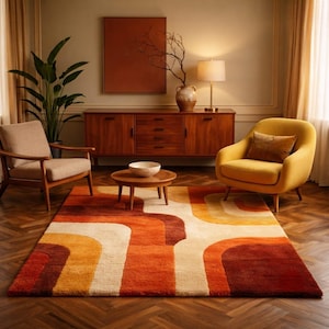May include: A rectangular area rug featuring a bold, geometric pattern of interlocking curved shapes in shades of burnt orange, deep red, golden yellow, and cream. The rug has a thick, plush texture and covers a portion of the wooden floor.
