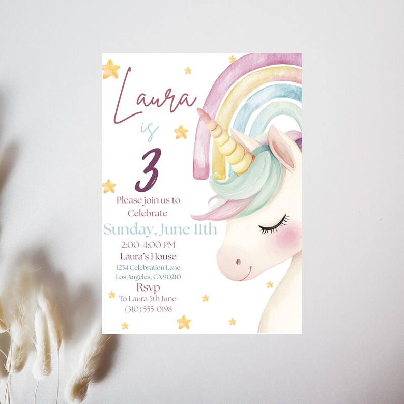 May include: A pastel-coloured invitation card with a unicorn illustration and a rainbow. The text reads "Laura is 3" with event details: Sunday, June 11th, 2:00-4:00 PM, and an RSVP. The design includes stars and a soft, watercolour style.