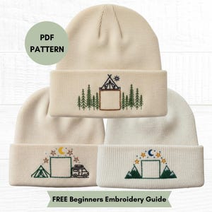 May include: Three cream-colored knit beanies featuring embroidered nature-themed designs. The top beanie shows a tent and pine trees. The bottom left beanie displays a tent, camper, and moon. The bottom right beanie shows mountains and a moon. PDF PATTERN.