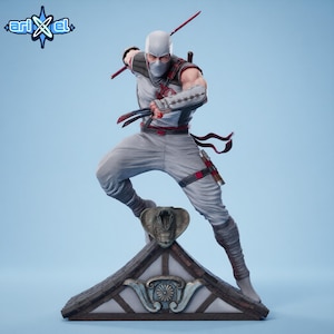 May include: A detailed figurine of a ninja in a dynamic pose, clad in a gray and white outfit with red accents. The figure is holding weapons and stands on a decorative base with a cobra emblem. The Arikel logo is in the upper left corner.