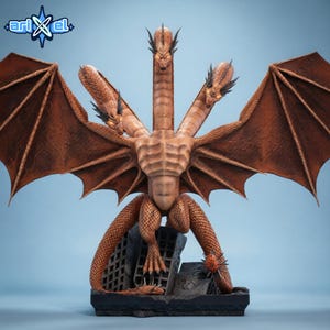 May include: A detailed brown dragon statue with three heads and large wings. The dragon is posed atop a crumbling building, with intricate scale and wing details. The statue has a textured appearance and is set against a light blue background.