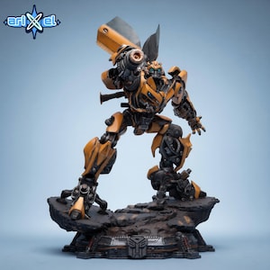 May include: A detailed figurine of the Transformers character Bumblebee in a dynamic pose. The figure is predominantly yellow and black, with intricate mechanical detailing. It stands on a rocky base with the Autobot symbol.