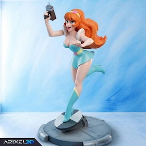 May include: A stylized figurine of a character with long orange hair, wearing a light blue dress with a yellow belt and matching boots. The character holds a brown rectangular device in one hand and stands on a circular base with a gray and white pattern.