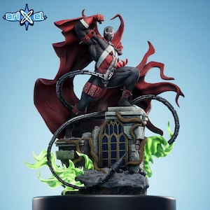 May include: A Spawn figurine featuring a black and white suit with red accents, a flowing red cape, and silver chains. The character stands on a stone ruin base with a gothic window and green flame effects. The logo "arixel" is visible in the top left.