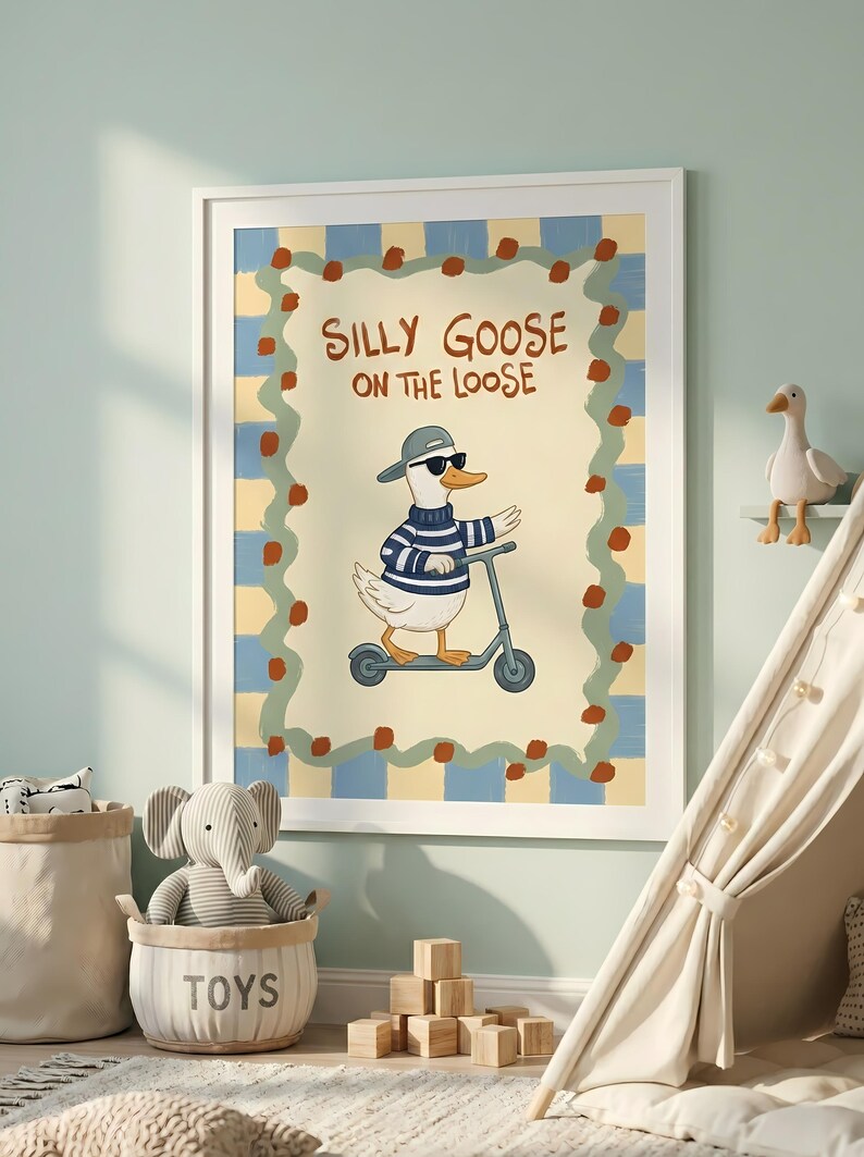 a framed poster of a cartoon goose riding a scooter, surrounded by a checkered border and a playful design. The poster is displayed on a wall in a child's bedroom, with a beige tent and a basket of toys nearby.