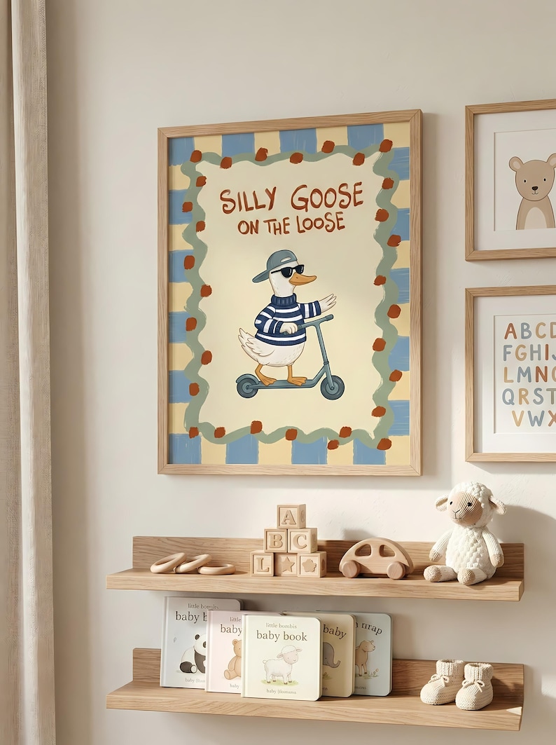 a wall with a framed poster of a cartoon goose riding a scooter, surrounded by a checkered border. Below the poster, there are two wooden shelves displaying children's books and toys, including a stuffed sheep and a wooden car.