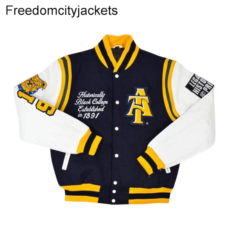 May include: A navy blue and white varsity jacket with yellow accents. The jacket features the text "Historically Black College Established in 1891" and a large yellow "AT" logo. The sleeves are white with yellow stripes.