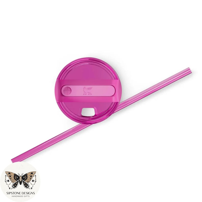 May include: A magenta-colored Stanley brand tumbler lid and straw set. The lid has a rectangular accent with a logo and a small circular opening. The straw is long and straight. The set is on a white background.