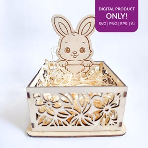 Puede incluir: Una cesta de Pascua de madera con un diseño floral cortado con láser y un recorte de conejito. La cesta está llena de paja y tiene el texto "DIGITAL PRODUCT ONLY!" en un cuadro morado. Se enumeran los formatos de archivo SVG, PNG, EPS y AI.