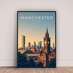 May include: A framed art print featuring a stylized illustration of the Manchester, England skyline. The print showcases a clock tower, modern skyscrapers, and the text "MANCHESTER ENGLAND" in white. The color palette includes shades of blue, orange, and brown.
