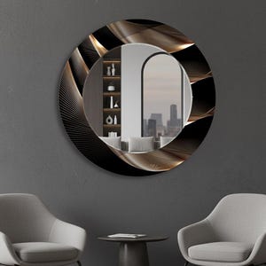 May include: A circular mirror featuring a black and gold wave pattern. The mirror is mounted on a grey wall. The reflection shows a room with a window and a city skyline.