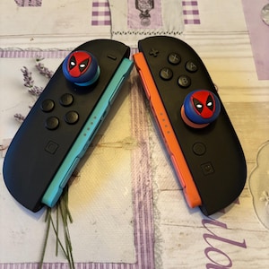 Deadpool Switch2 poignées pour manette de jeu, capuchons en silicone pour manette de jeu Nintendo Switch2/ps5/xbox - Cadeaux accessoires gaming