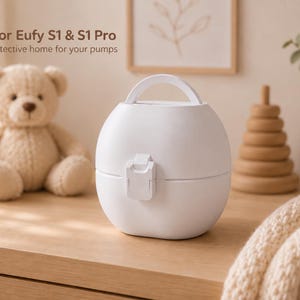 May include: A white, rounded, portable storage case with a top handle and a front latch closure. The text on the image reads: Made for Eufy S1 & S1 Pro. A cosy, protective home for your pumps. The container has a smooth, matte finish and a compact design.
