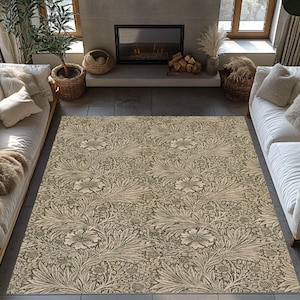 May include: A large rectangular area rug with a floral pattern in shades of beige and olive green. The rug features a repeating design of stylized flowers and leaves, creating a vintage or botanical aesthetic. The rug is placed in a living room setting.