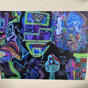 May include: Colorful abstract art print on black background. The artwork features a face, mushrooms, and text including "DON'T CRY" and "BACK 2 REALITY". The color palette includes blue, green, purple, and red.