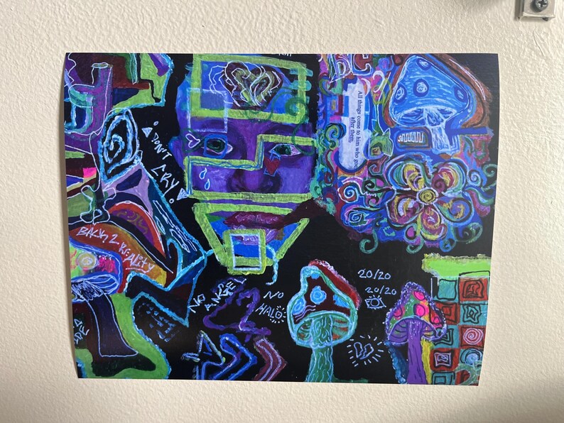 May include: Colorful abstract art print on black background. The artwork features a face, mushrooms, and text including "DON'T CRY" and "BACK 2 REALITY". The color palette includes blue, green, purple, and red.