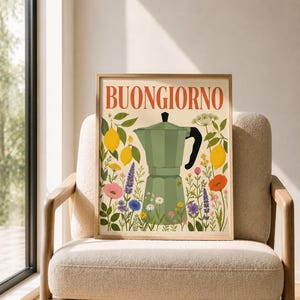 May include: A framed wall art print featuring a light green moka pot centered among colorful illustrations of lemons, poppies, cornflowers, and daisies, with the word BUONGIORNO printed in large, bold, orange-red capital letters at the top.