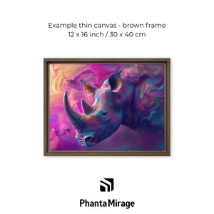 May include: A framed canvas print with a brown frame, showcasing a rhino illustration. The artwork measures 30 x 40 cm. The rhino is rendered in shades of blue, purple, and pink, creating a vibrant and artistic piece.