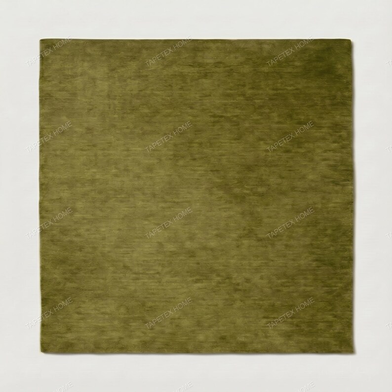 May include: A square, olive green rug with a soft, textured surface. The rug is set against a white background. The words "TAPETEX HOME" are repeated around the edges of the rug.