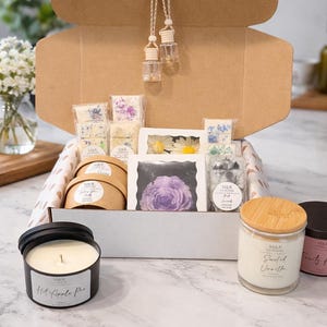 May include: A set of three ceramic mugs with a speckled, matte finish. The mugs are in shades of cream, light gray, and dark gray. Each mug has a simple, minimalist design and a rounded handle. Perfect for coffee or tea.