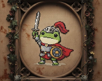 May include: Cross-stitch artwork featuring a green frog knight with a sword and shield, wearing a helmet and red cape. The piece is set within an ornate wooden frame with floral detailing.