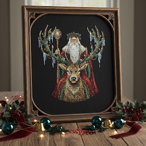 May include: Framed cross-stitch art featuring Santa Claus riding a reindeer, adorned with festive details. Santa wears a red and green robe, holding a staff. The reindeer has antlers decorated with icicles. The artwork is set against a black background.