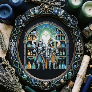 May include: A circular framed cross-stitch depicting two knights in armour, set against a backdrop of potion bottles. The frame is intricately decorated with gargoyles and other embellishments. The colour scheme is dominated by blues, greens, and golds, evoking a fantasy aesthetic.