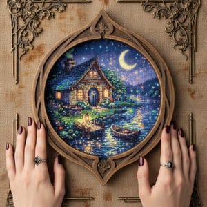 Moonlit Cottage Cross-Stitch Pattern – Cozy Fantasy Night Scene (PDF)
This enchanting cross-stitch design features a glowing fairy cottage beside a tranquil lake under a crescent moon. Warm window light, lantern reflections, and star-filled skies create a peaceful fantasy atmosphere perfect for cozy home décor.