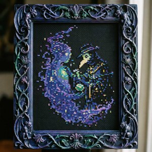 May include: Cross-stitch art in a dark, ornate frame. The artwork depicts two figures, one ethereal and the other in a plague doctor's attire, in shades of blue, purple, and green against a black background. The frame is dark blue with decorative carvings.