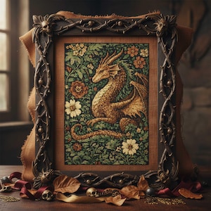 May include: A framed cross-stitch featuring a golden dragon amidst a floral tapestry of green, orange, and white. The dark wooden frame has ornate, gothic-style detailing. The artwork is displayed on a wooden surface with decorative skulls and leaves.