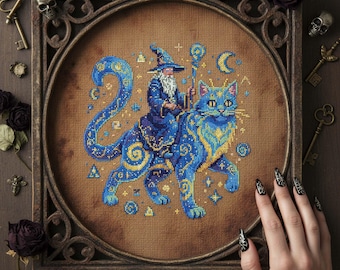 May include: Cross-stitch artwork of a wizard riding a blue cat, presented in a decorative wooden frame. The wizard is dressed in a blue robe and hat, holding a staff. The cat features yellow and blue patterns. The artwork is surrounded by keys, skulls, and roses.