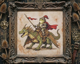 May include: Cross-stitch picture of a frog knight on a green dragon, in a dark wood frame. The knight is armoured, with a red cape and spear. The dragon has detailed scales and wings. The frame has decorative carvings.