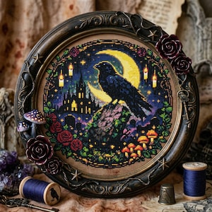 May include: A framed cross-stitch featuring a black raven perched on a rock, set against a night sky with a crescent moon and a castle silhouette. The frame is adorned with roses and mushrooms, creating a gothic aesthetic.