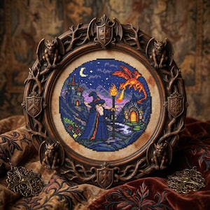May include: A framed cross-stitch depicting a wizard, dragon, and castle under a starry night sky. The round artwork is set in a dark brown, ornate frame with gargoyle and shield details. The color palette includes blues, oranges, and greens.