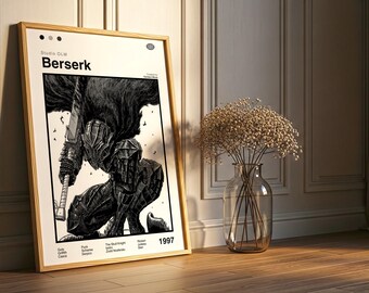 May include: A framed print featuring the word "Berserk" and an illustration of a character in armor holding a large sword. The print is in a wooden frame and leans against a wall. A vase of dried flowers sits nearby.