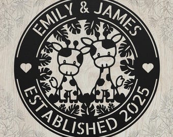 May include: A circular black metal wall sign featuring a cutout design of two giraffes surrounded by tropical leaves. The text "EMILY & JAMES" is arched at the top, and "ESTABLISHED 2025" is at the bottom, with a small heart on each side.