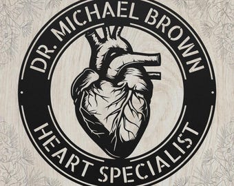 May include: A circular black metal sign featuring a detailed anatomical heart illustration in the center. The text DR. MICHAEL BROWN is arched across the top, and the words HEART SPECIALIST are arched across the bottom of the border.