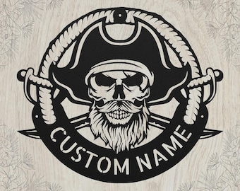 May include: A circular black metal wall sign featuring a central pirate skull wearing a tricorn hat and a long beard. The skull is framed by a rope border and two crossed swords. The text CUSTOM NAME is arched along the bottom edge.