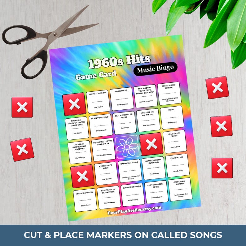 May include: A 1960s Hits Music Bingo game card with a tie-dye background. The card features song titles and a grid of squares with red X markers. Scissors and additional red X markers are also present.