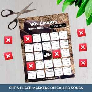 May include: A 90s Country Music Bingo game card with song titles and a cowboy hat graphic. Red X markers are scattered around the card, and a pair of scissors is visible. The text "CUT & PLACE MARKERS ON CALLED SONGS" is at the bottom.