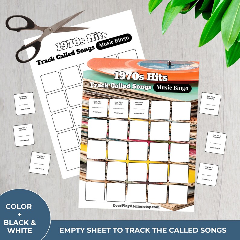 May include: A music bingo game sheet with the text "1970s Hits Track Called Songs Music Bingo." The game sheet is white with blank squares for song titles and artist names. A pair of scissors and small cards are also present.