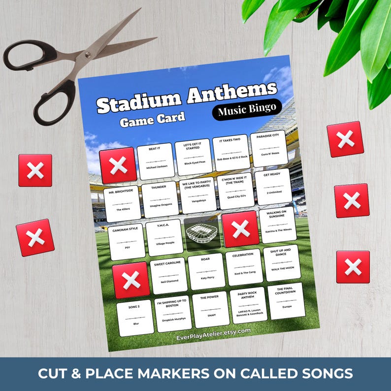 May include: A Stadium Anthems Music Bingo game card featuring a grid of song titles and artists, with a stadium background. The card includes red square markers with white X symbols, a pair of metal scissors, and the text EverPlayAtelier.etsy.com.