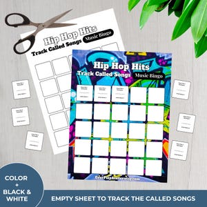May include: Two "Hip Hop Hits" music bingo sheets with blank squares for song titles and artist names. One sheet is white, the other has a colorful graffiti design. Scissors and small cards are also present.