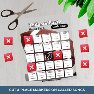 May include: A Tailgate Party Music Bingo game card with a football design. The card features song titles and spaces for markers. Red X markers and scissors are also visible, suggesting a DIY game.