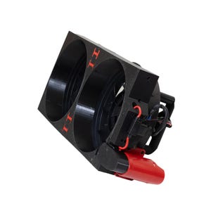 May include: A black, rectangular device with two circular openings. The device has red accents, including the letters "II" and a red cylindrical component. Wires and other components are visible.