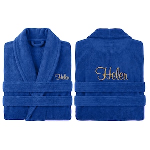 May include: A royal blue terry cloth bathrobe with a shawl collar and waist tie. The name "Helen" is embroidered in gold script on the front and back. The robe is shown from the front and back.