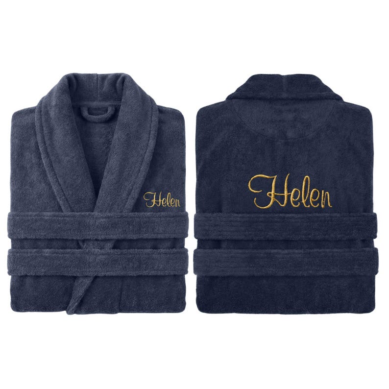 May include: Navy blue terry cloth bathrobe with the name "Helen" embroidered in gold script on the front and back. The robe features a shawl collar, two front pockets, and a matching belt. The plush fabric is visible in a front and back view.