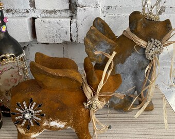 A pair of aged flying crown pigs, rusty set, shelf sitters