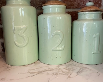 A set of 3 kitchen canisters, numbered storage, farmhouse kitchen