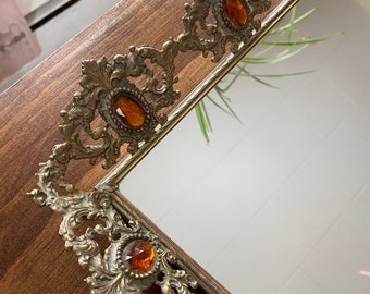 Hollywood Regency antique filigree vanity tray with burnt orange glass stones.